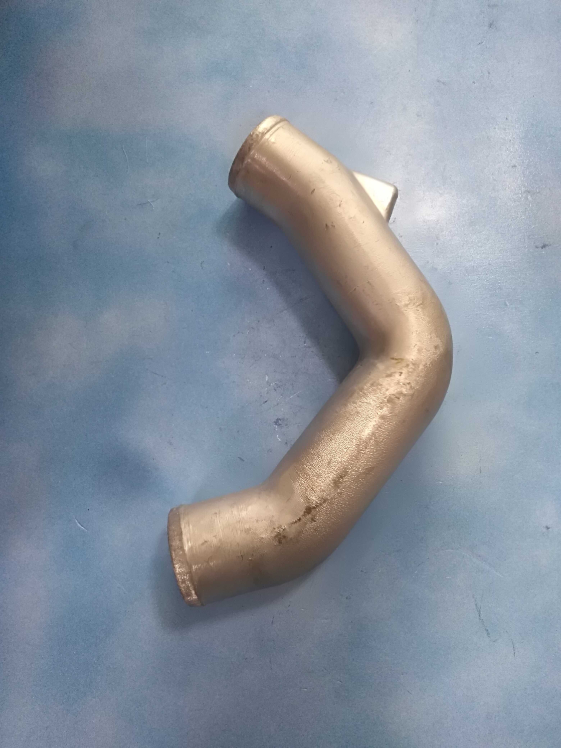 Колено отводящего патрубка 